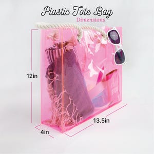 a pink plastic tote bag with a pair of sunglasses on it