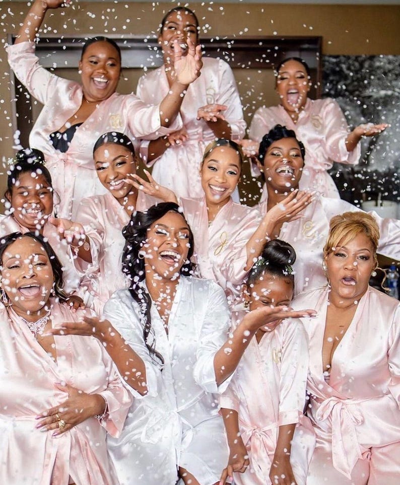 a group of women standing next to each other