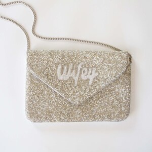 a purse with a name on it sitting on a table