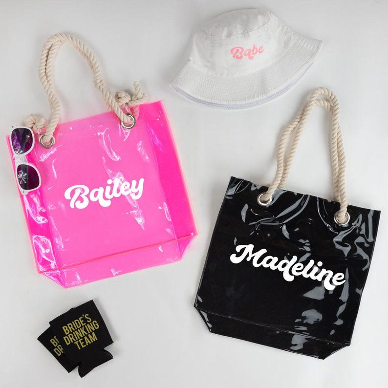 two bags and a hat on a table