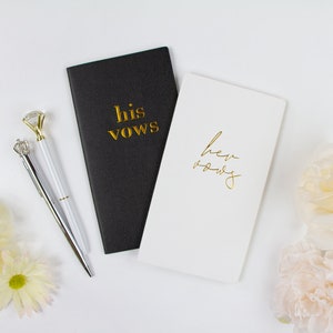a couple of notebooks sitting on top of a table