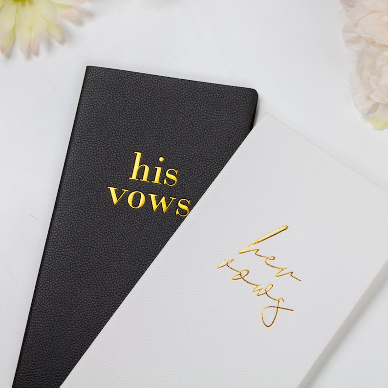a couple of black and white cards sitting on top of a table