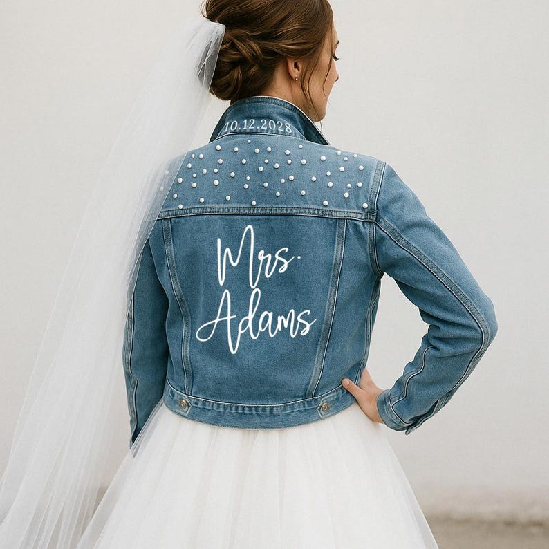 a woman in a wedding dress and denim jacket
