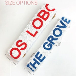 two straps with text on them, one in red and one in blue, with size options indicated below.