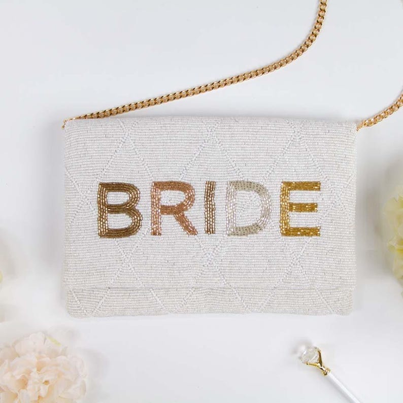 a white purse with the word bride written on it