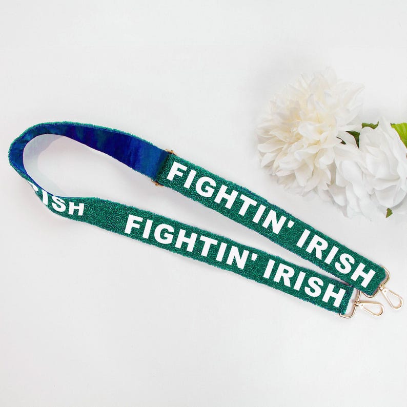 a pair of green lanyards with the words fightin'irish on them