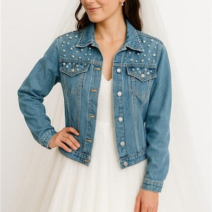 a woman in a wedding dress and denim jacket