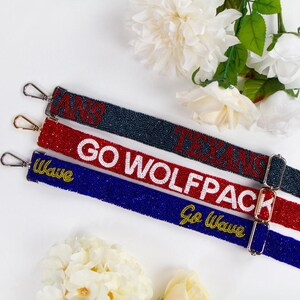 a pair of lanyards that say go wolfpack