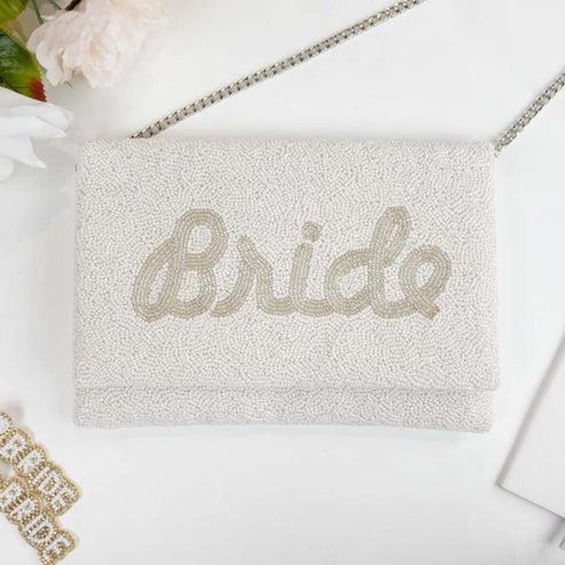 a white purse sitting on top of a table