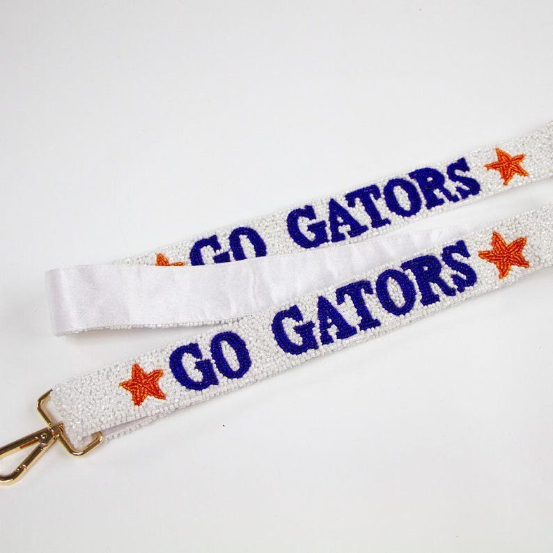 two white lanyards with red and blue stars on them