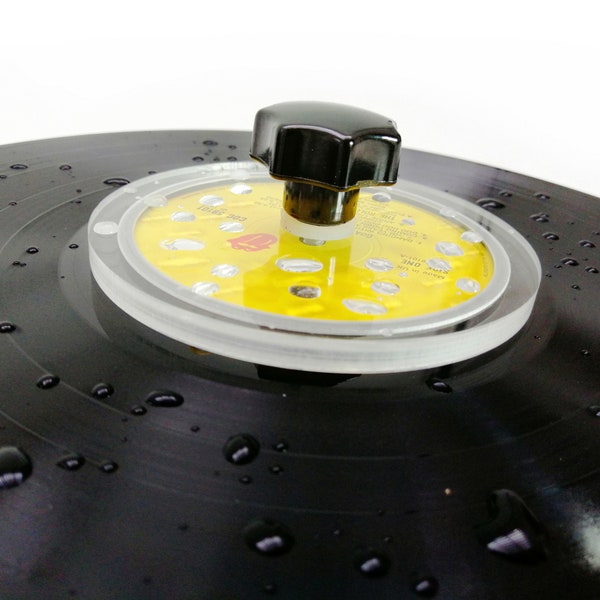 Vinyl record label protector to protect vinyl record labels during washing and cleaning