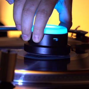Vinyl record stabilizer with remote controlled color changing LED lights