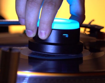 Vinyl record stabilizer with remote controlled color changing LED lights