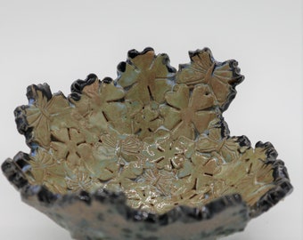Bowl, flowers and butterflies spiral around this stunning unique bowl.