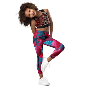 Livfulla abstrakta mönster barnleggings och färgglada tights
