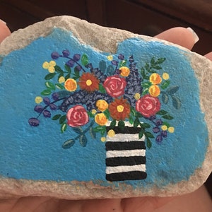 Colorful boho floral arrangement in a cute vase hand painted rock sealed in resin