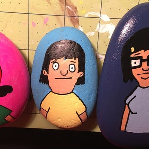 Bob’s Burger characters hand painted rock sealed in resin