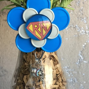 Blue gray medicine vial cap badge  holder with Super RN logo