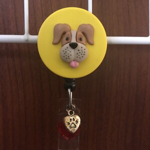 Tan dog face badge holder