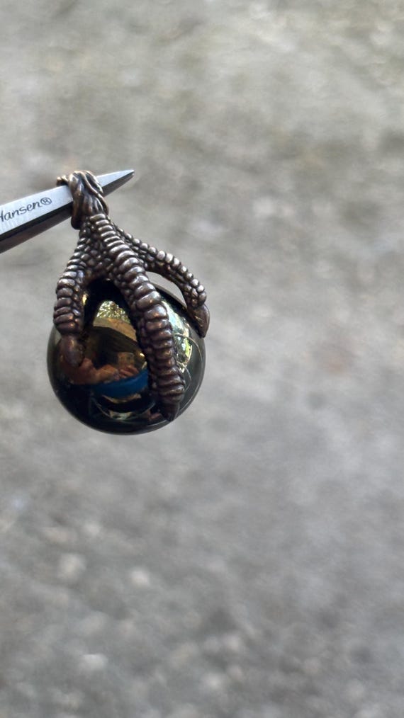 Sterling silver dragon, claw holding hematite ball