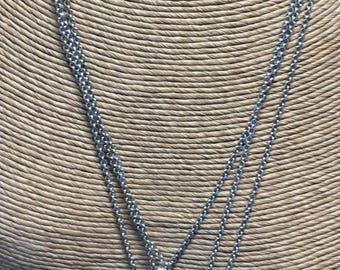 Brighton brand, Silvertone triple strand Charm necklace