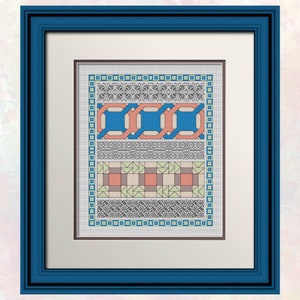 Op de afbeelding: Een ingelijst kruissteekontwerp met verschillende geometrische patronen in tinten blauw, rood, groen en beige. Het ontwerp is omgeven door een zwarte rand en een witte passe-partout.