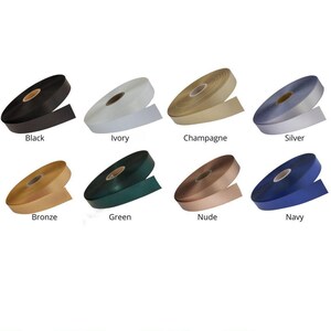 a collection of eight different colored ribbons, each with a label indicating its color.