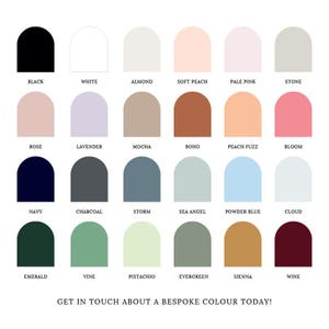a collection of 24 different color swatches for foamboard arranged in a grid format, each representing a unique color. The colors include black, white, almond, soft peach, pale pink, stone, rose, lavender, mocha, bohem, peach fuz, bloom, navy, charcoal, storm, sea angel, powder blue, cloud, emerald, vine, pistachio, evergreen, senna, wine. The image is a collage of these color swatches, and the text at the bottom invites viewers to "Get in touch about a bespoke colour today!"