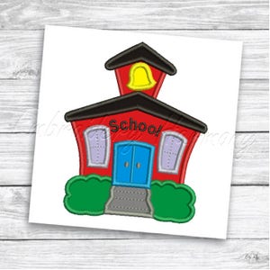 May include: Red schoolhouse with a black roof, a yellow bell on top, and a blue door. The schoolhouse has two windows on each side and the word "School" written on the front.
