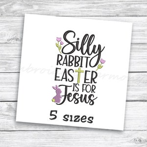 May include: Embroidered design with the text "Silly Rabbit Easter is for Jesus" in black with a purple bunny and a green cross. The text "5 sizes" is below the design.