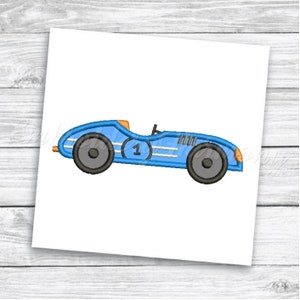 May include: A blue vintage race car with a white stripe and the number "1" on the side. The car has black wheels and orange details.