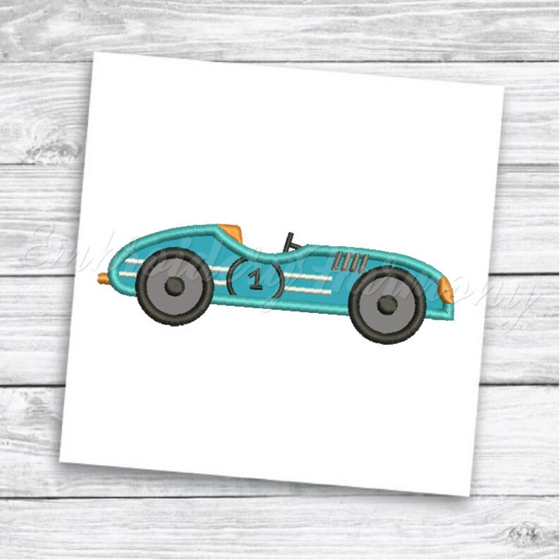 May include: A blue vintage race car with a white stripe and the number "1" on the side. The car has black wheels and orange accents.