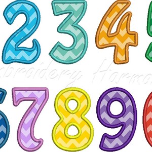 May include: A set of ten colorful numbers with a chevron pattern. The numbers are outlined in a contrasting color. The numbers are 1 through 10.