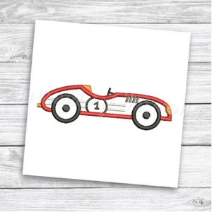 May include: Red and black vintage race car with a white number one on the side.