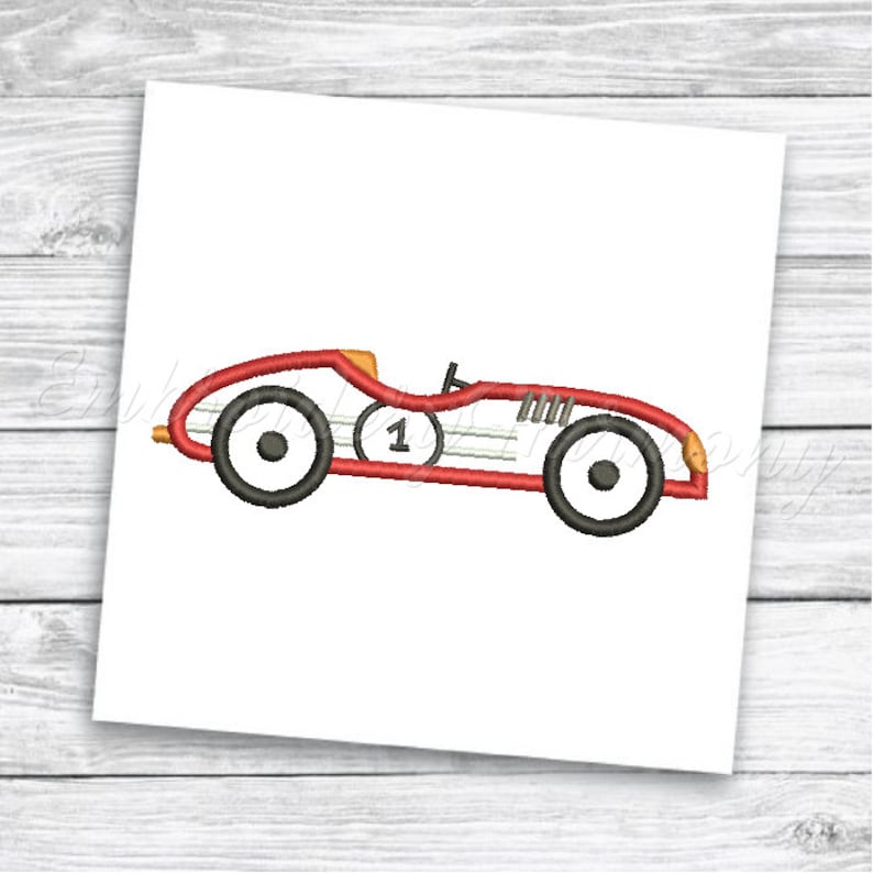 May include: Red and black vintage race car with a white number one on the side.