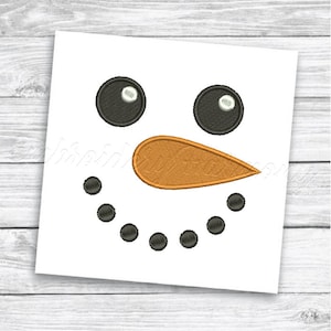 May include: A simple snowman face embroidery design with black eyes, a black smile, and an orange nose.
