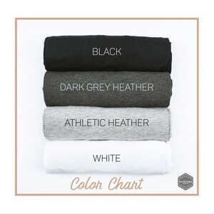 May include: Color chart showing four t-shirt colors: black, dark grey heather, athletic heather, and white. The text "Color Chart" is printed below the swatches.