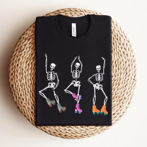 Dancing Skeletons Roller Skate Shirt: Retro Halloween T-Shirt
