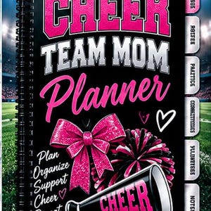May include: A black spiral-bound planner with the text CHEER TEAM MOM Planner in pink and silver. It features a pink glittery bow, a pom-pom, and a megaphone with the word CHEER. Side tabs include labels like Practice and Notes, with the text Big Bearded Bear LLC at the bottom.