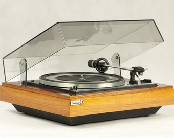 DUAL 1218 turntable, manufactured in the 1970s. Great sound and unique design of bygone years. Fully functional.