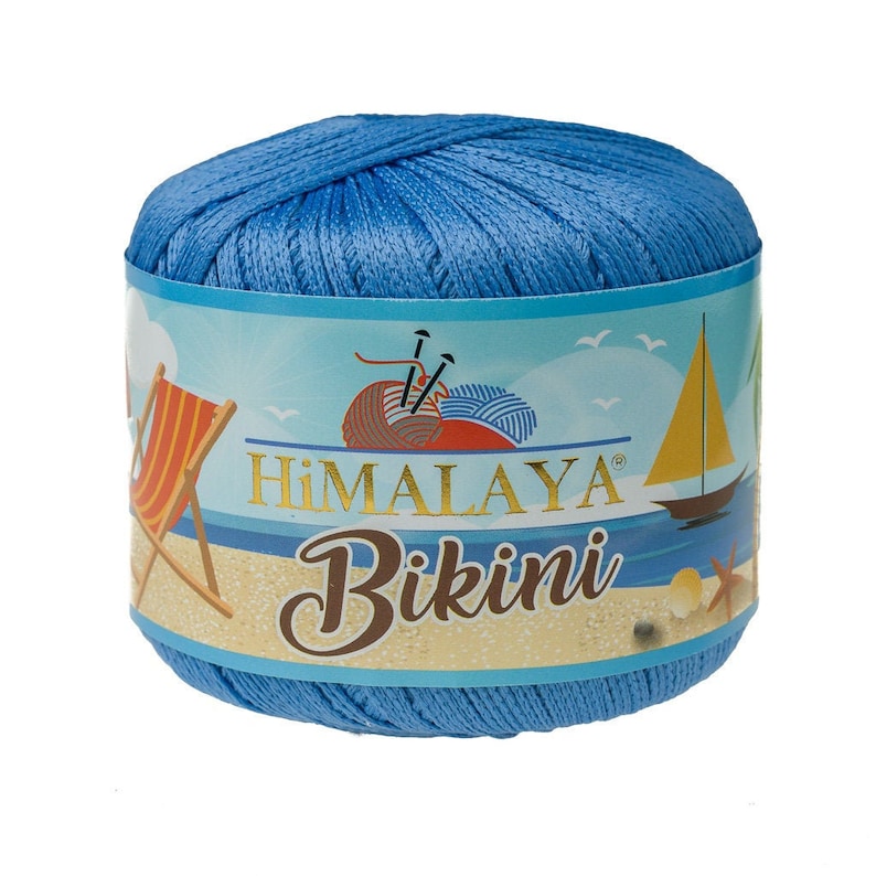 May include: A skein of blue yarn labeled "HIMALAYA Bikini" with a beach scene on the label. The label features a beach chair, a sailboat, and seashells.