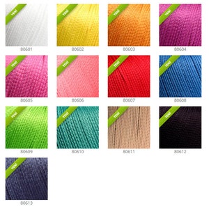 May include: A collection of 13 yarn skeins in various colors, including white, yellow, orange, pink, red, blue, green, teal, beige, black, and gray. Each skein has a label with the word "Yeni" and a number.