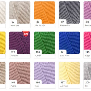 May include: A color chart of yarn samples with numbers and names in Turkish. The colors include white, cream, yellow, orange, green, blue, purple, pink, beige, gray, and lilac.
