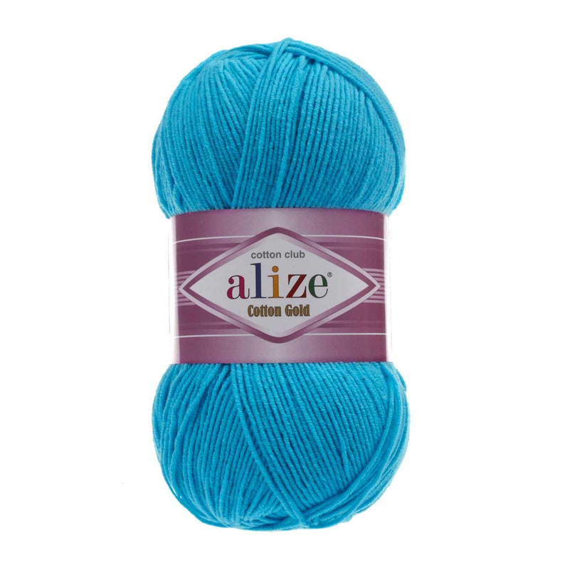 May include: A ball of bright blue cotton yarn with a label that reads "cotton club alize Cotton Gold"