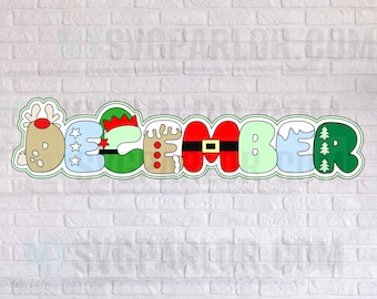 May include: A decorative sign spelling "DECEMBER" with each letter designed with a Christmas theme. The letters are outlined in green and feature reindeer, elf, Santa, and winter elements. The sign is set against a white brick wall.