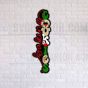 May include: Black and green vertical sign with the word "cookies" spelled out in white letters with gingerbread cookie designs. The word "baked" is written in red cursive letters.