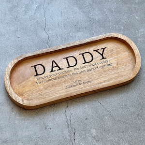 May include: Wooden tray with the words "DADDY, Empty your pockets. We can't wait to play! You coming home is the best part of our day. Love, Jackson & Avery" engraved on it.