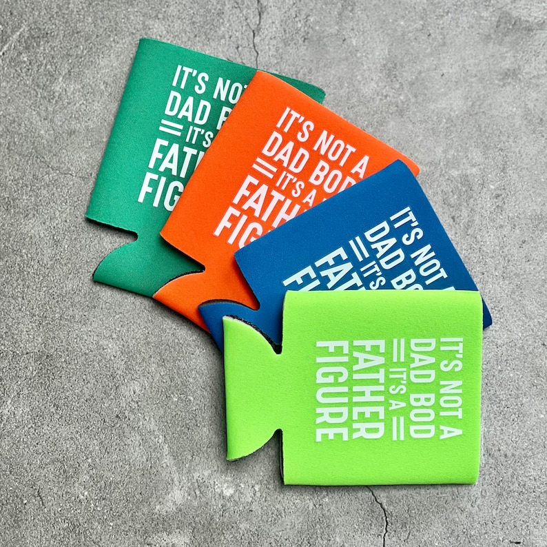 May include: Four green, orange, blue and lime green neoprene can coolers with white text that reads "It's not a Dad Bod, It's a Father Figure".