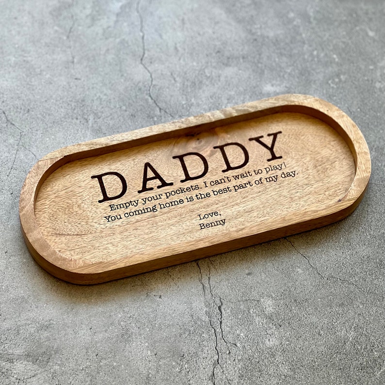 May include: Wooden tray with the text "DADDY Empty your pockets. I can't wait to play! You coming home is the best part of my day. Love, Benny" engraved on it.