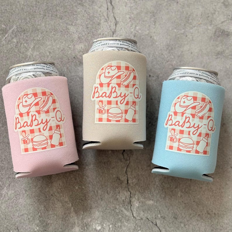 May include: Three can coolers in pink, beige, and blue, each with a "Baby-Q" design. The design includes a cowboy hat, hot dog, burger, baby bottle, and a pacifier on a red and white checkered background.